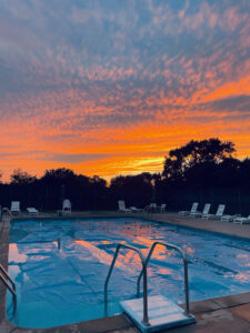 Picture of sunset at our outdoor pool in evergreen park